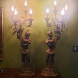 Paire de nubiens porte torchère en bois doré baroque