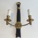 Pair of Black Lacquered Bronze Wall Lamps with Lions' Head Decorations. Around 1970