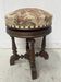 Napoleon III style piano stool in solid walnut, 20th century.