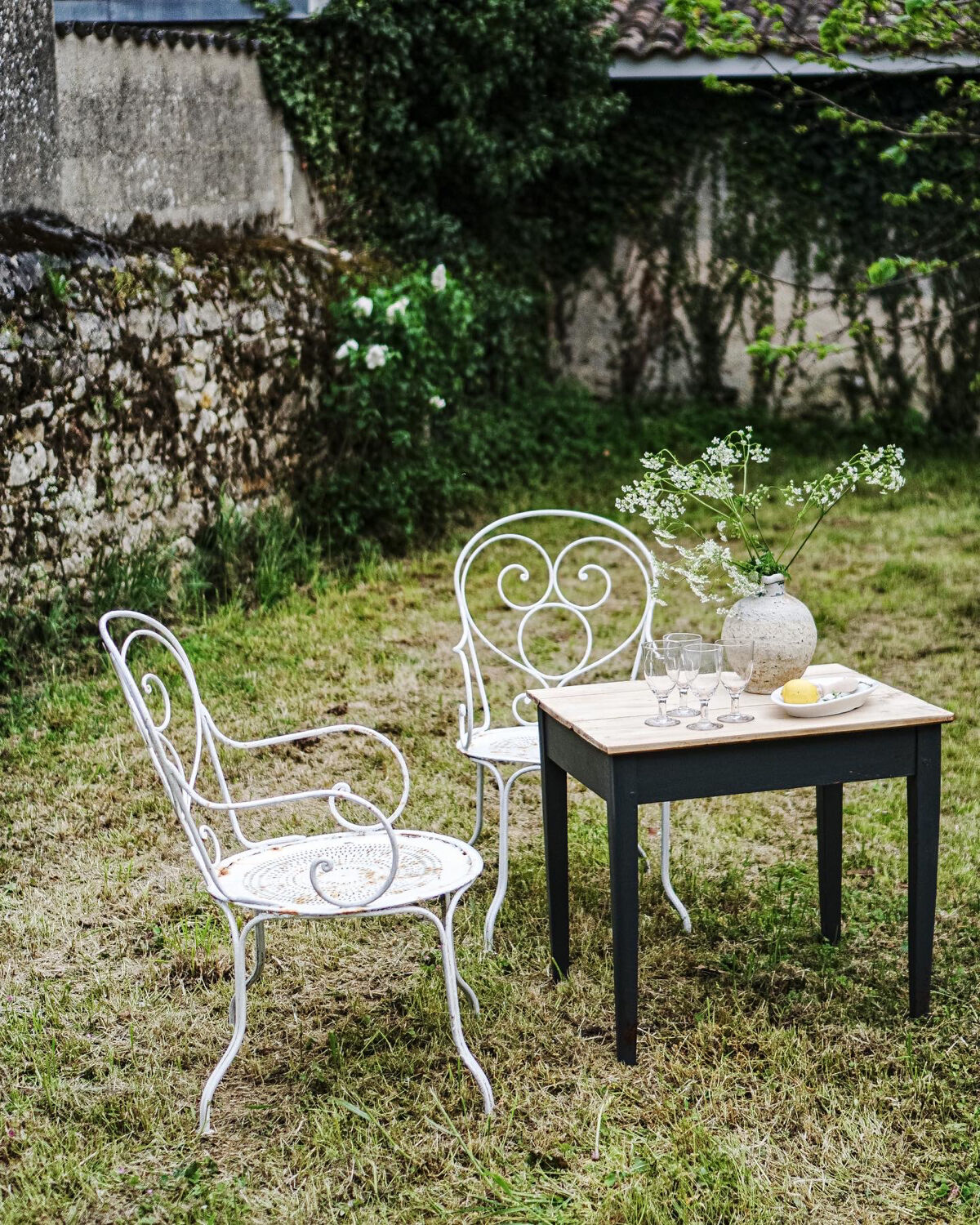 Duo of wrought iron armchairs