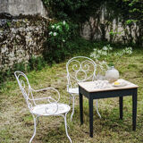Duo of wrought iron armchairs