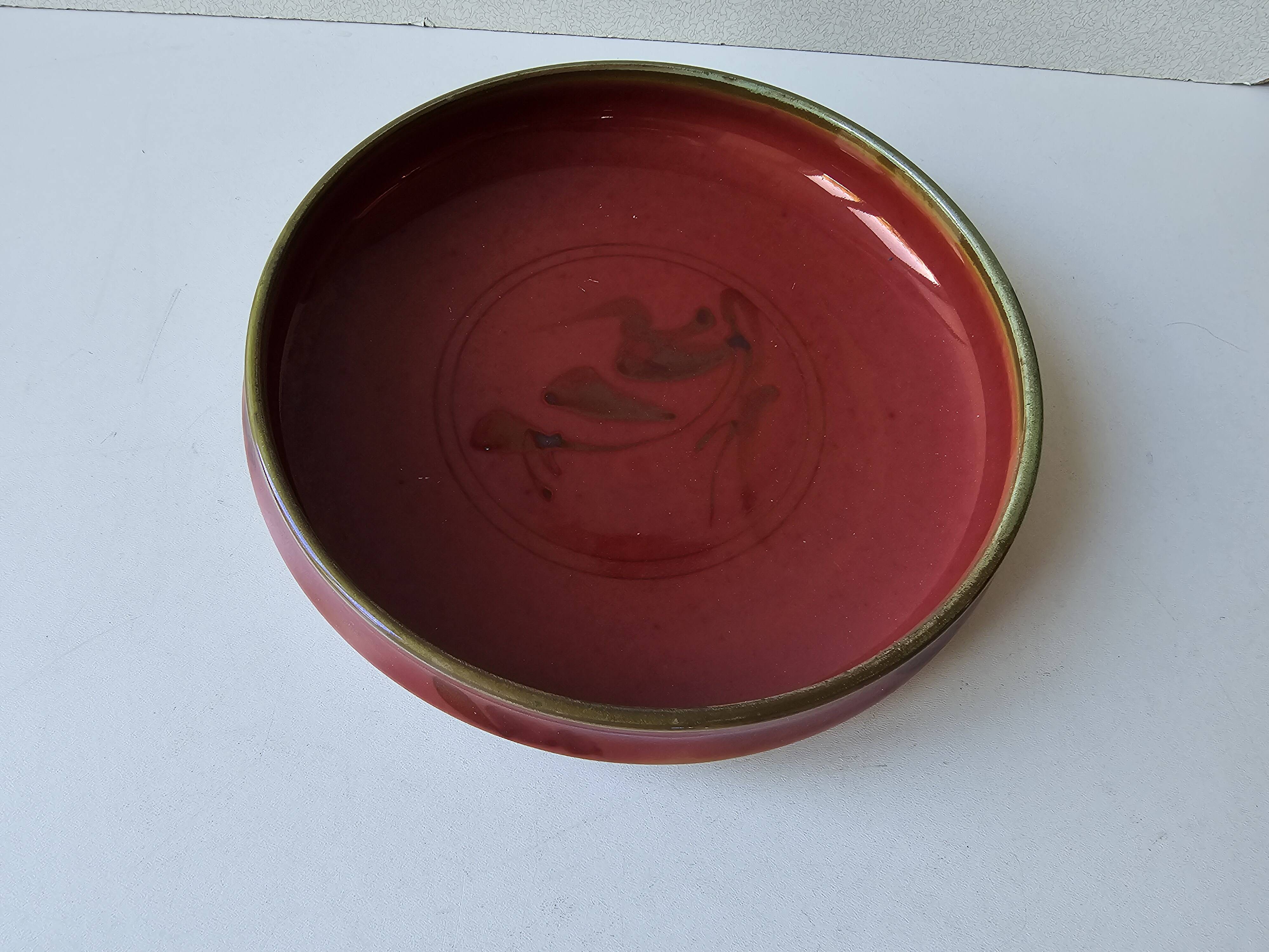 Red enamelled ceramic bowl emptier by Alain Déjardin