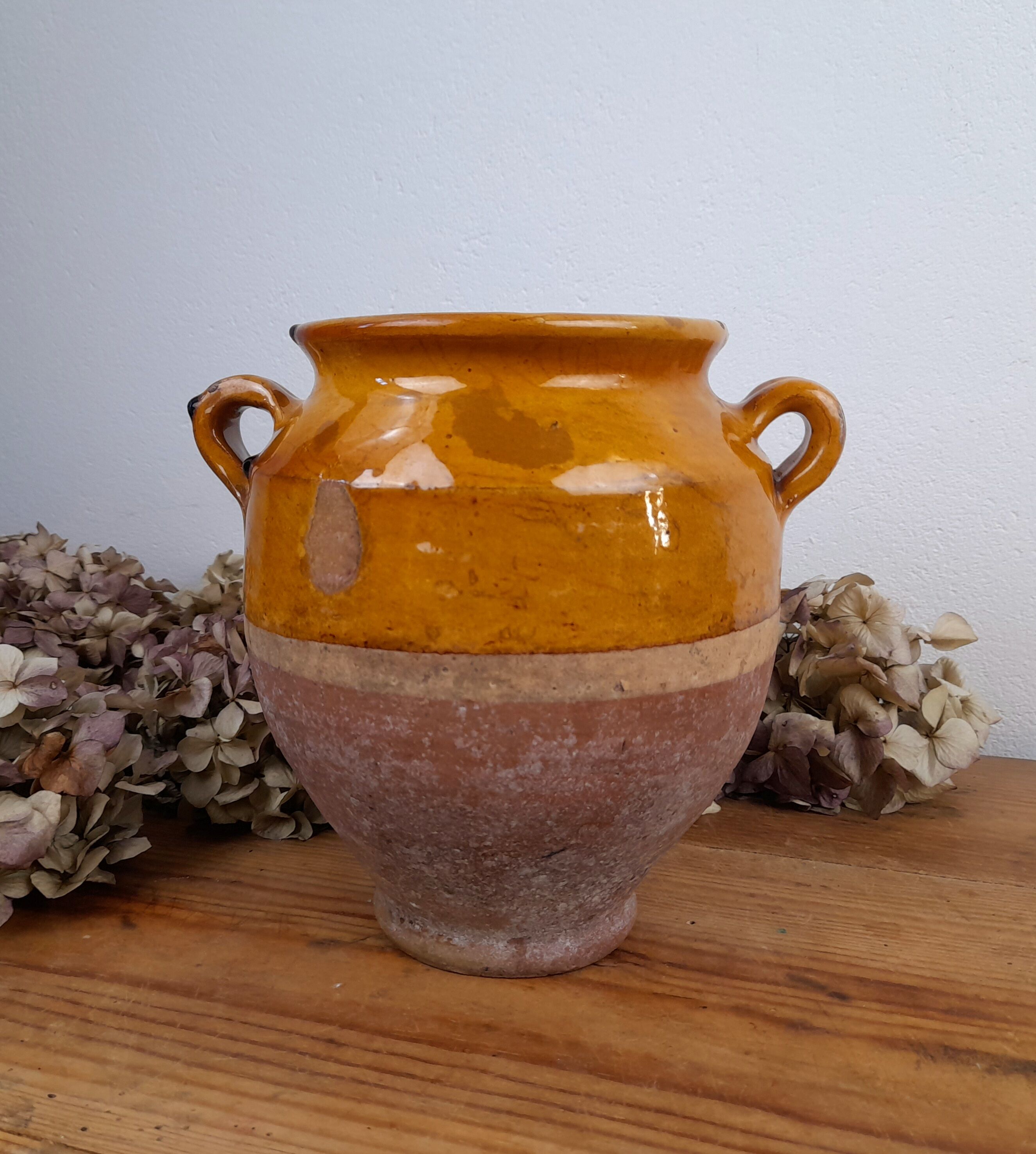 Old glazed terracotta grease pot