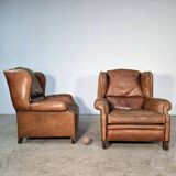 Beautiful pair of wide leather club armchairs with ears in Havana colour.