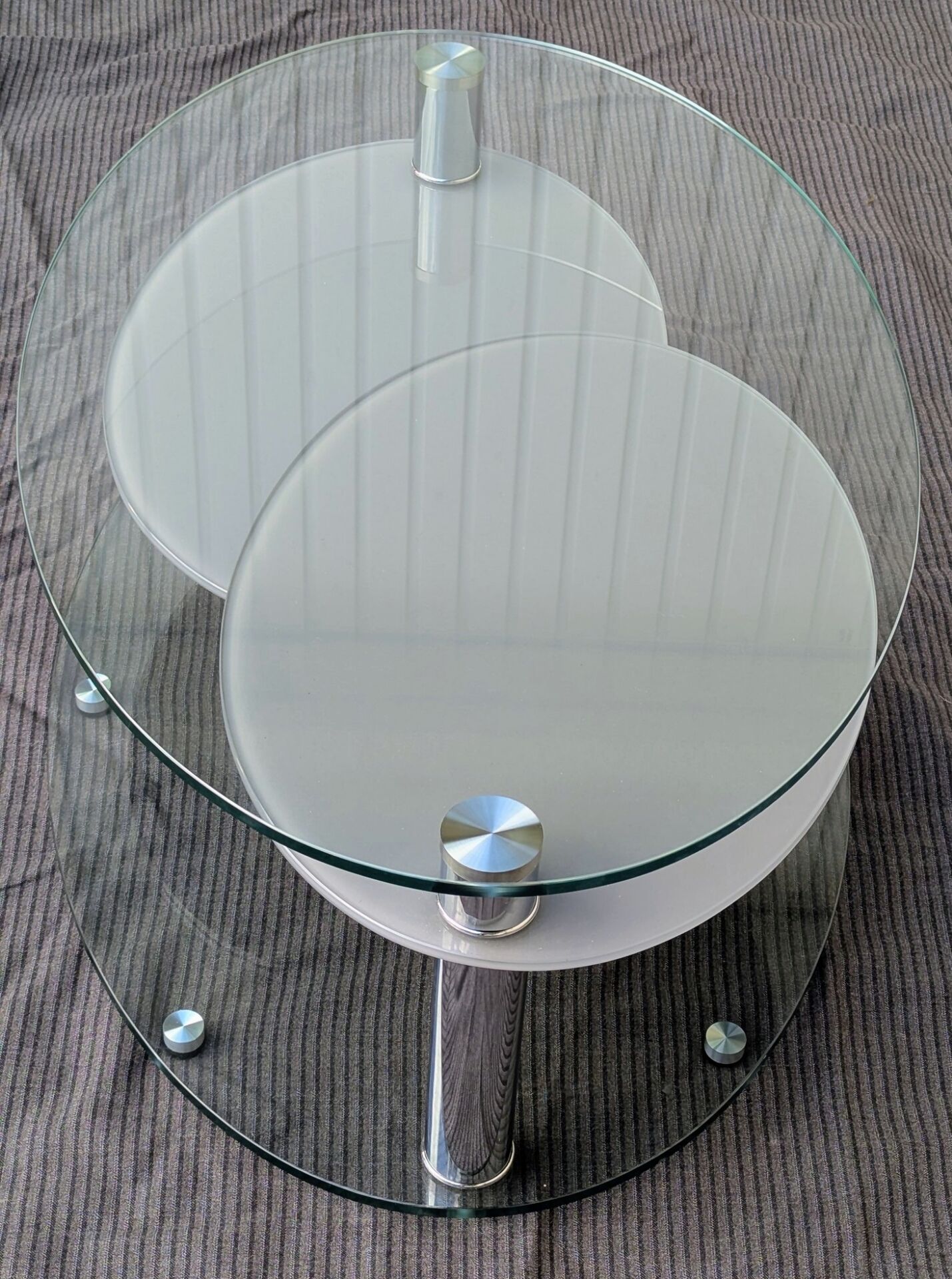 Coffee table with rotating glass tops by Antoine Motard.
