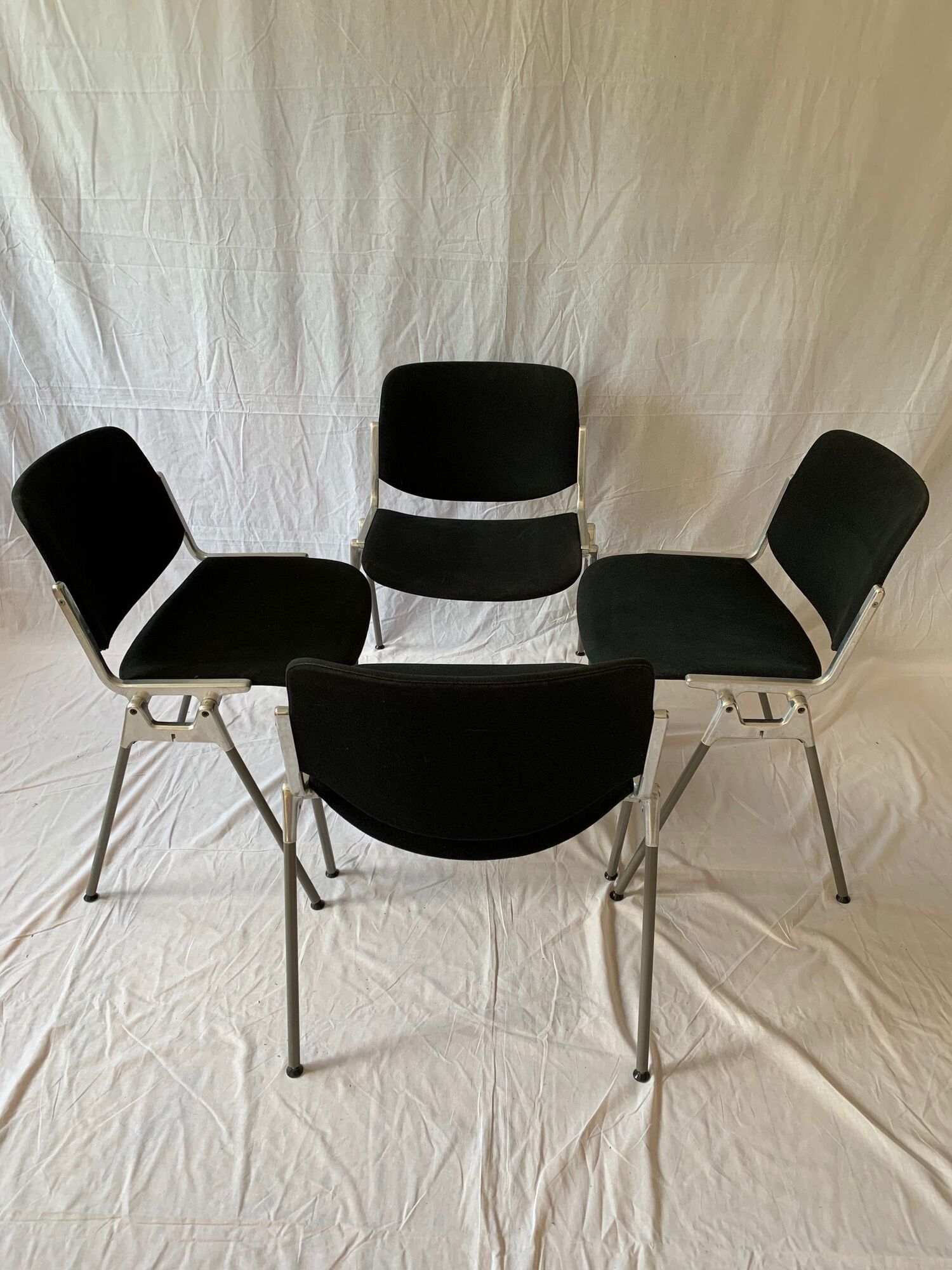 A set of four Castelli DSC 106 chairs, designed by G. Piretti, Italy, 90s