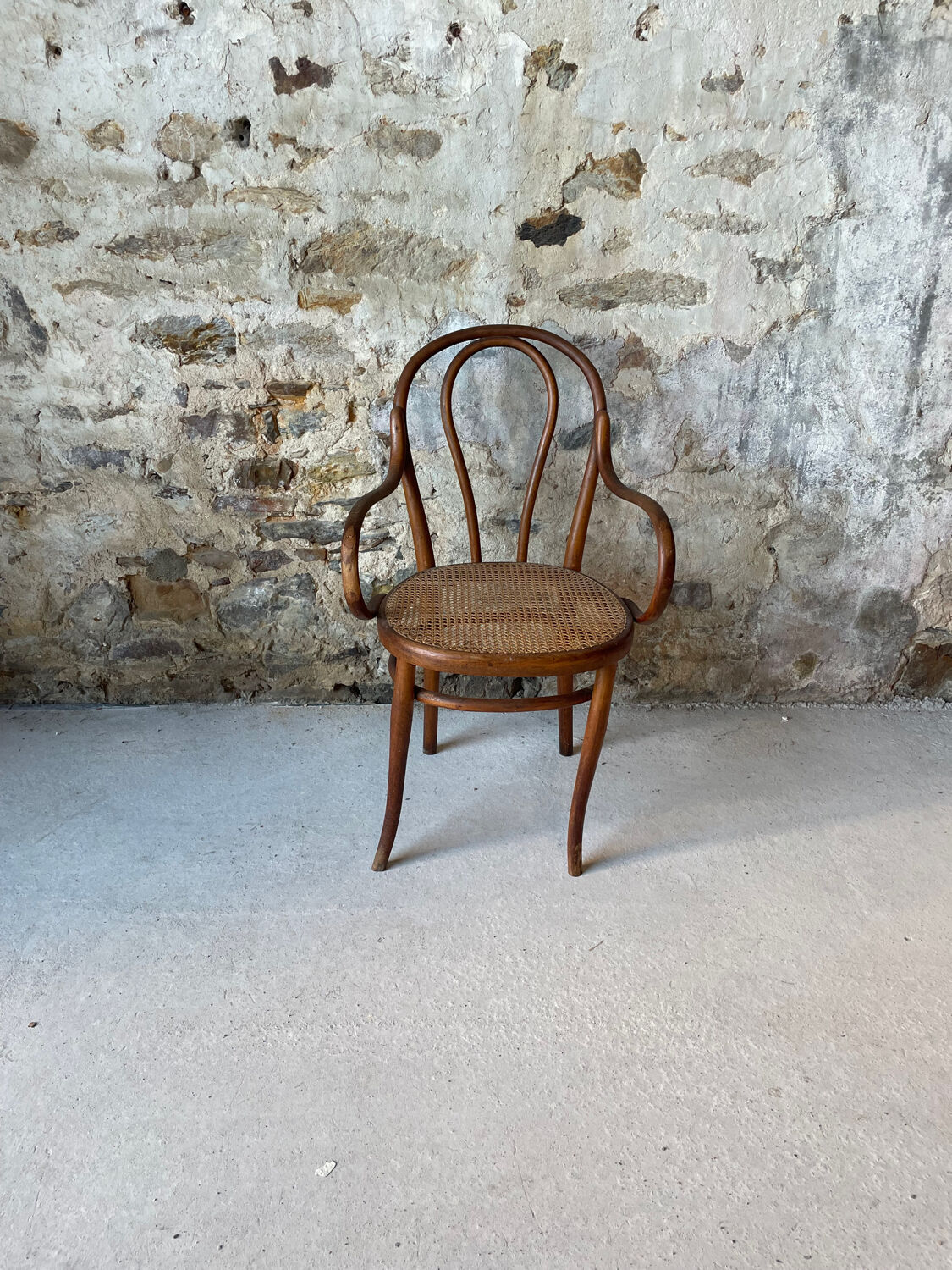 Thonet armchair with bent wood and caning