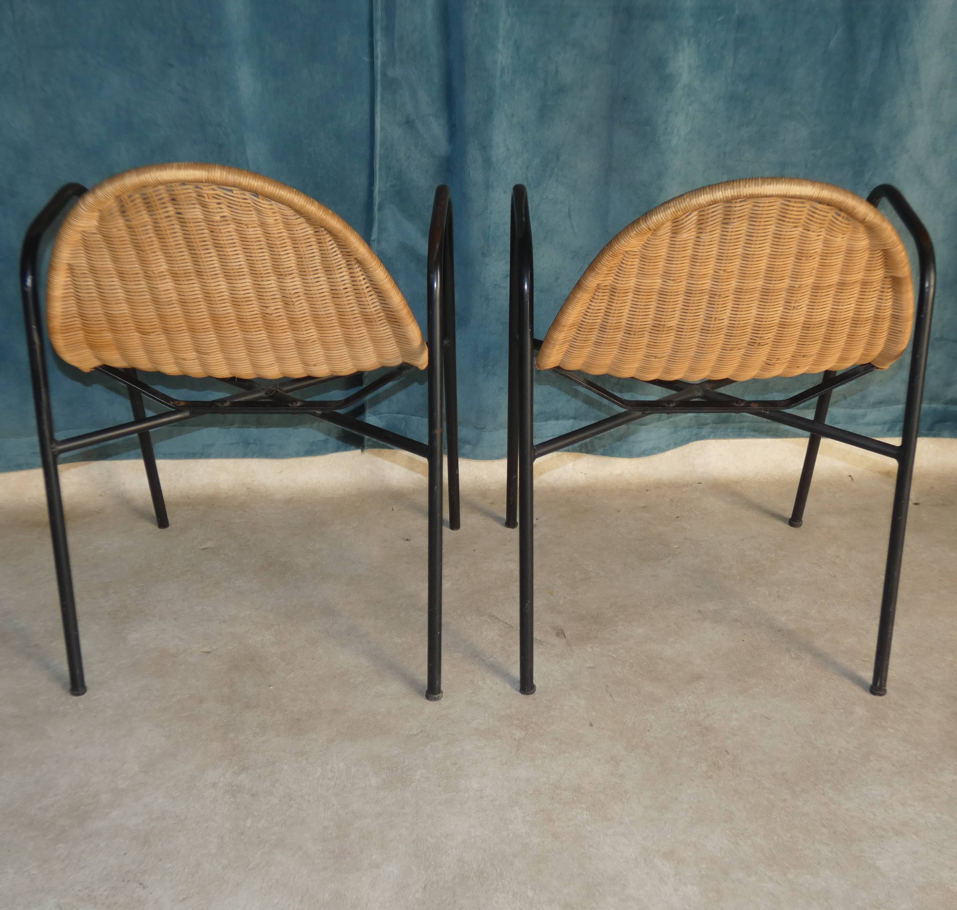 Pair of chairs / vintage armchairs in rattan and black lacquered metal