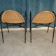 Pair of chairs / vintage armchairs in rattan and black lacquered metal