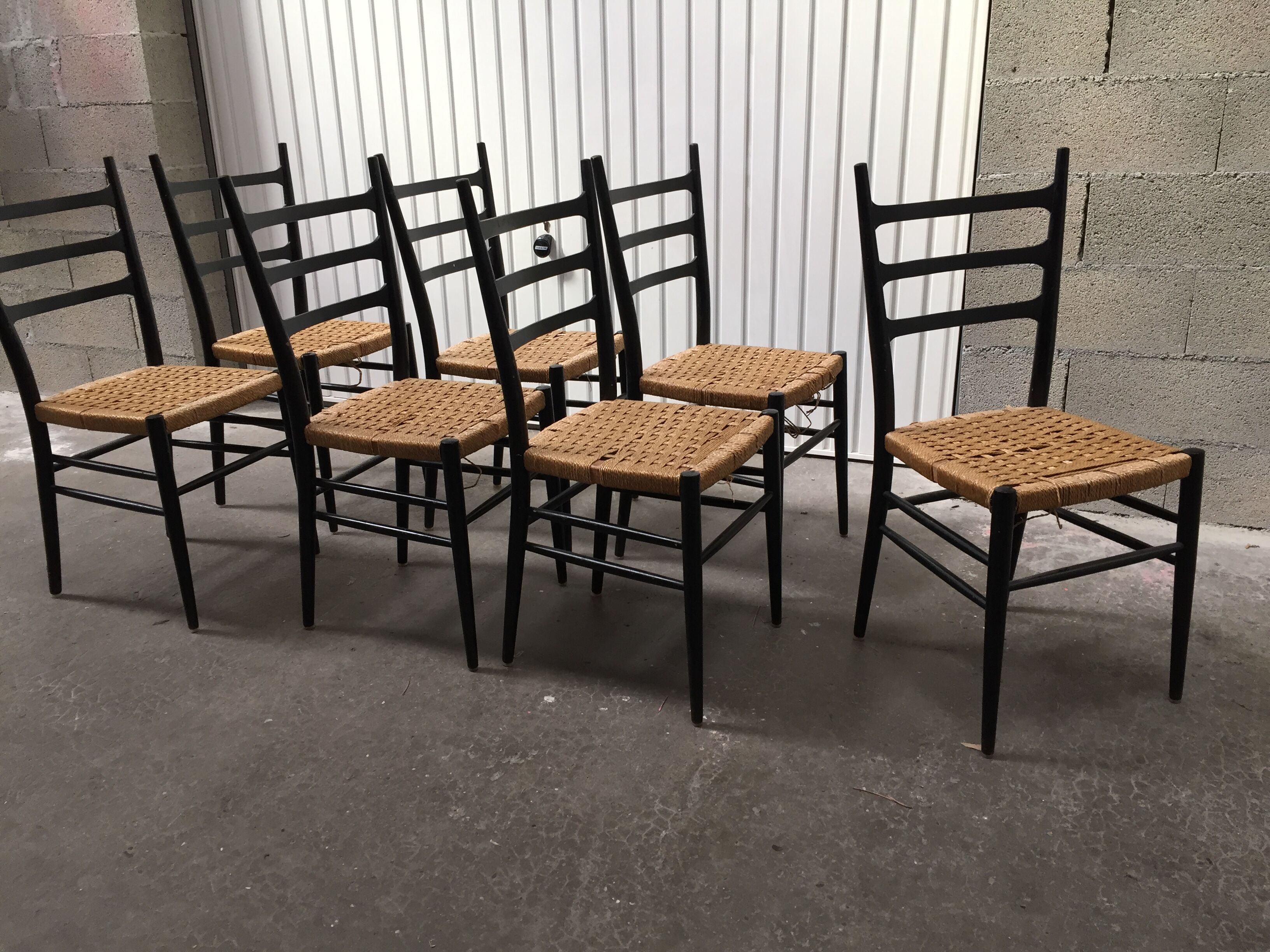 Set of 7 blackened wooden chairs, 1960s vintage