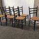 Set of 7 blackened wooden chairs, 1960s vintage