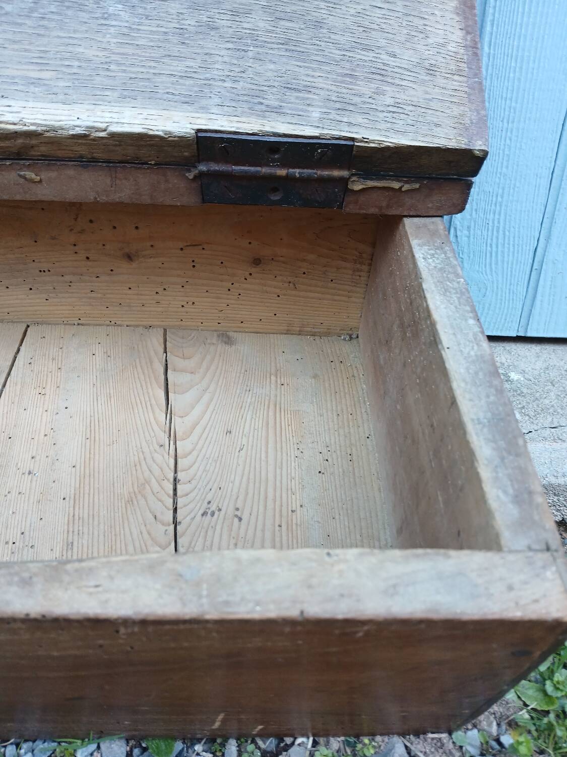 Small old wooden chest with hinged lid