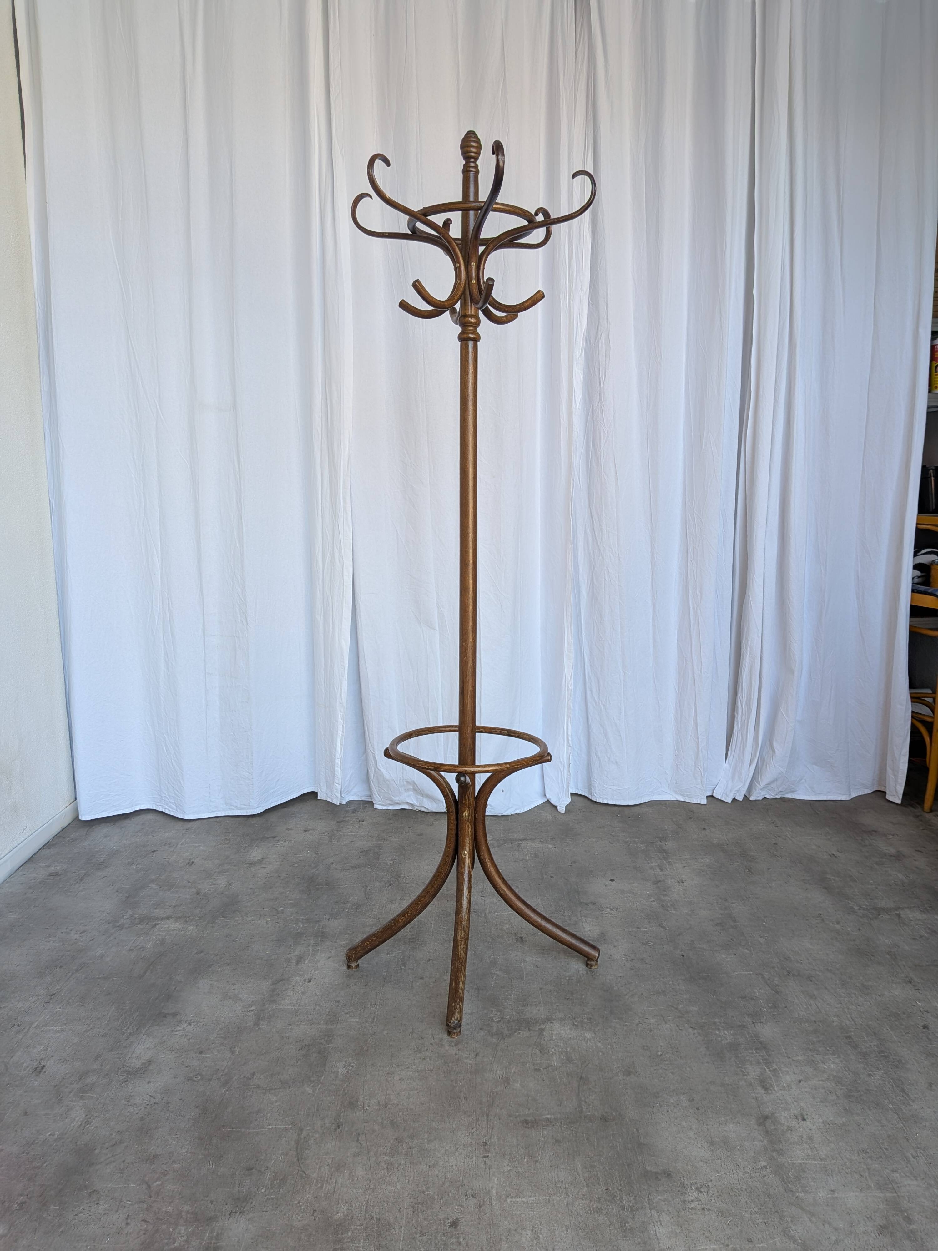 Vintage bentwood coat rack in Thonet style / Dark wood coat rack with shadow.