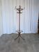 Vintage bentwood coat rack in Thonet style / Dark wood coat rack with shadow.