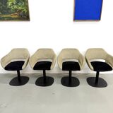 Series of six swivel chairs with an organic shell, patterned fabric and base.