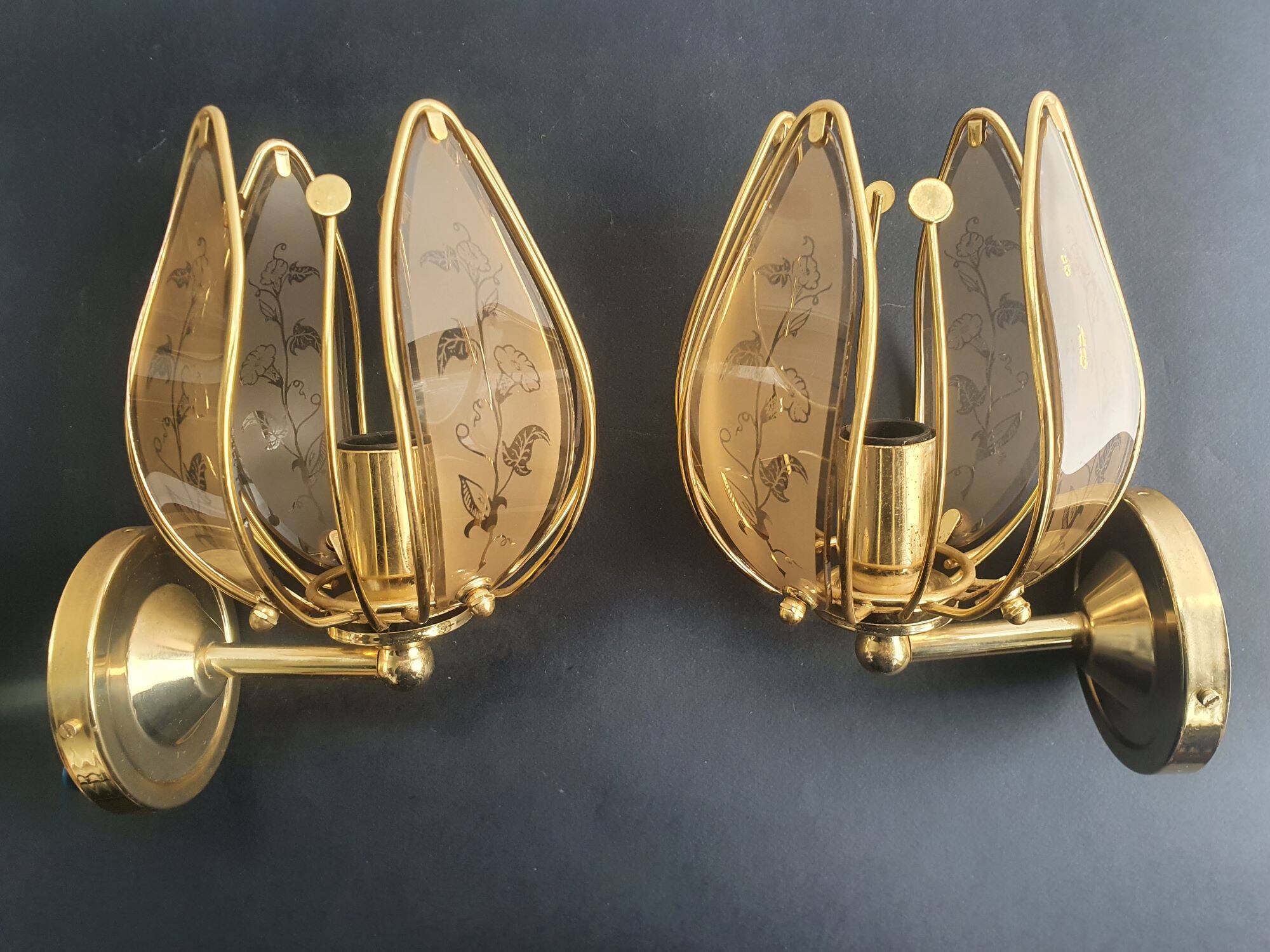 Pair of vintage brass wall sconces with glass shades