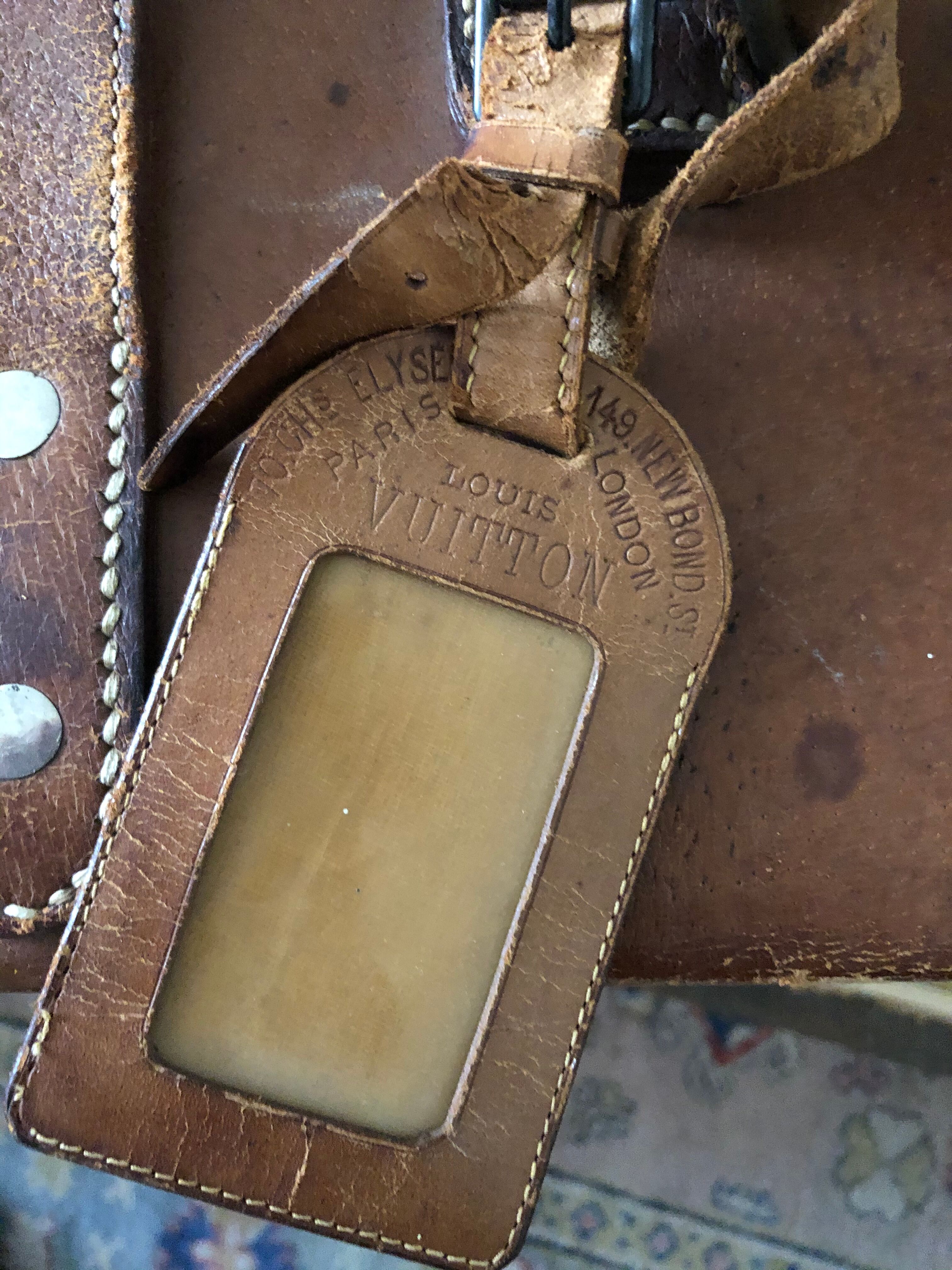 Former leather trunk with Louis Vuitton label holder