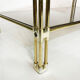 Brass two-tiered coffee table hollywood regency gold smoked glass 1970s