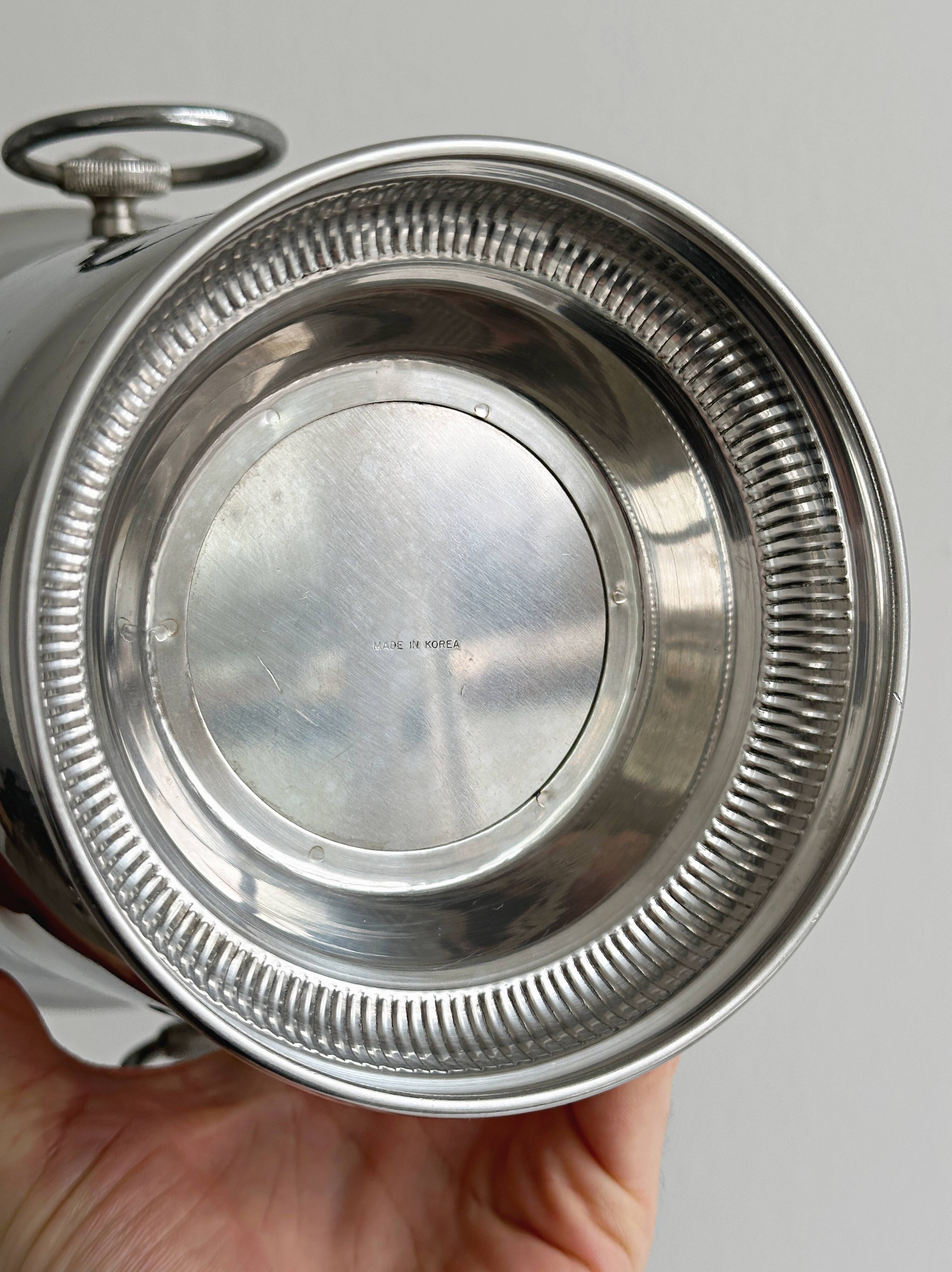 Shiny metal champagne bucket