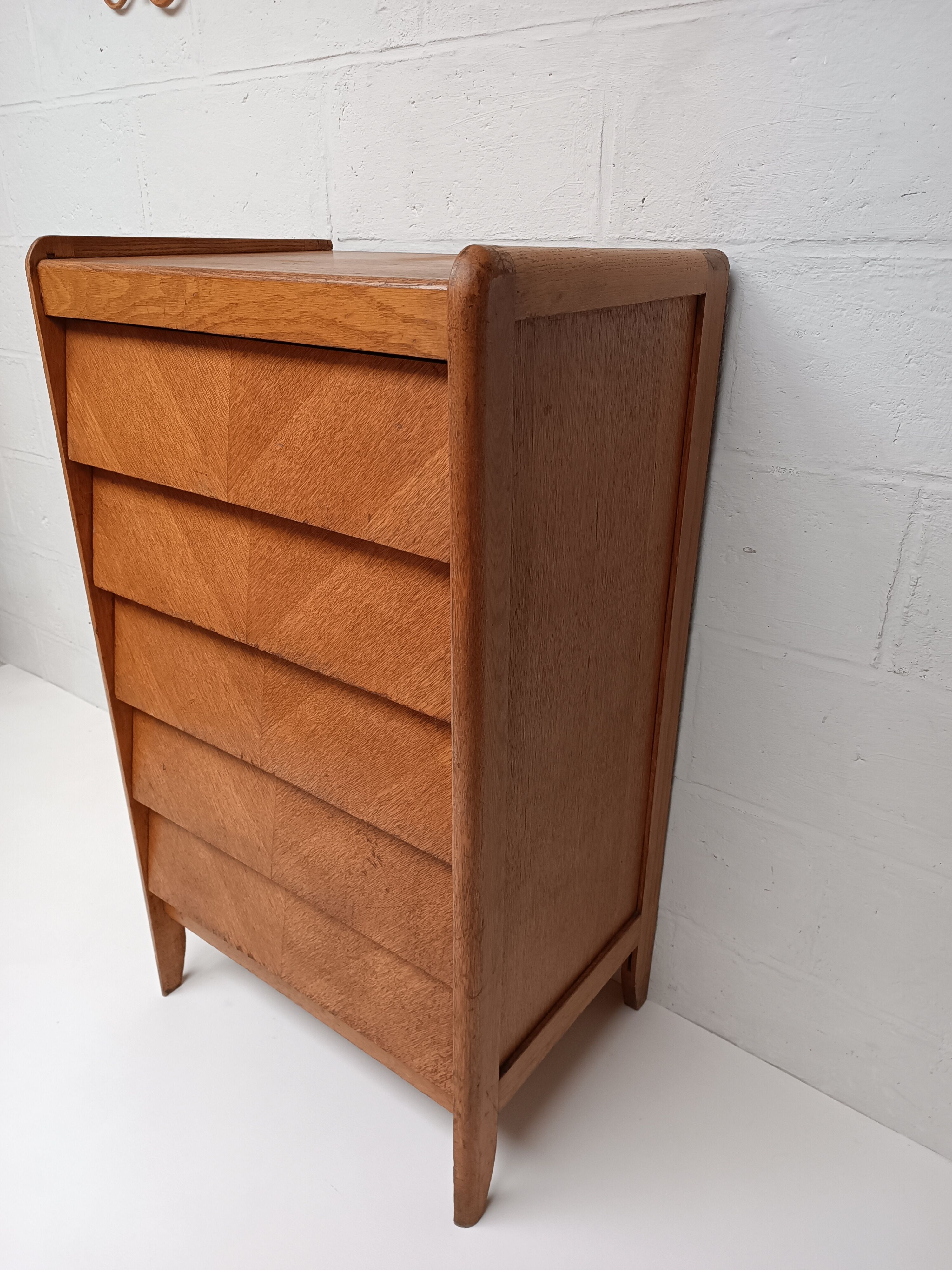 High wooden chest of drawers in the 50s