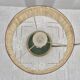 Brass table lamp with green patina and empire-style fabric shade.