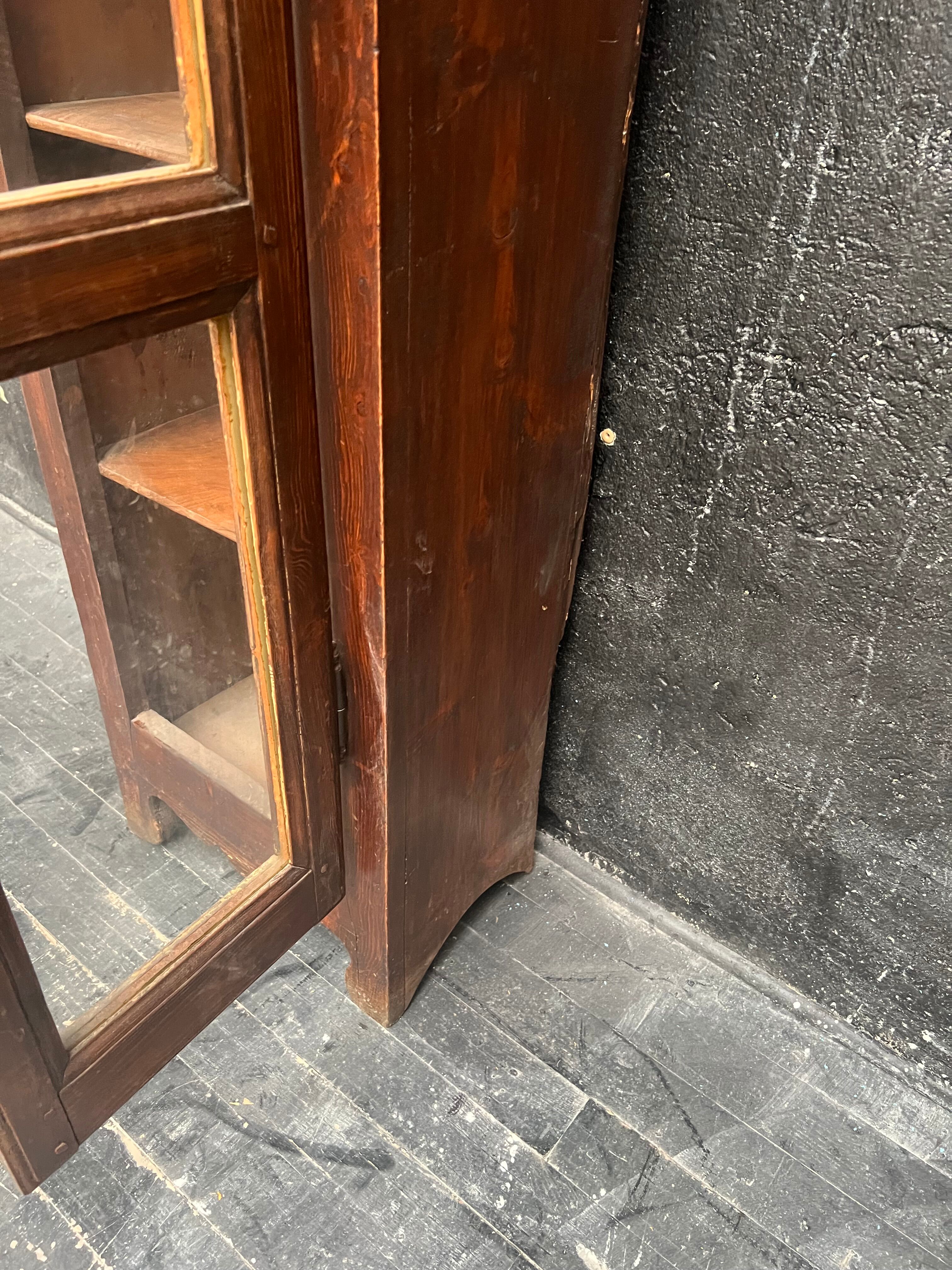 Old narrow wooden showcase.
