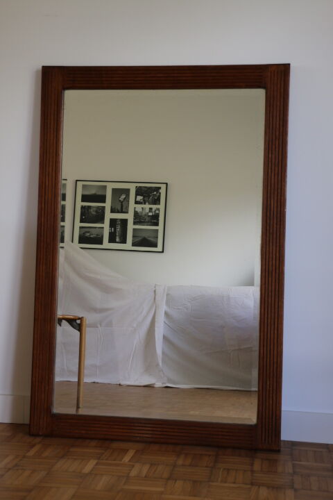 Beveled mirror grooved wood