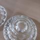 Moulded glass candle holders.