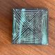 Pair of Robert Picault ceramic trivets with geometric patterns