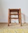 Old farmhouse stool made of wood and straw