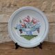 Plate with hand-painted flower bouquet on light blue background 25cm