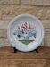 Plate with hand-painted flower bouquet on light blue background 25cm