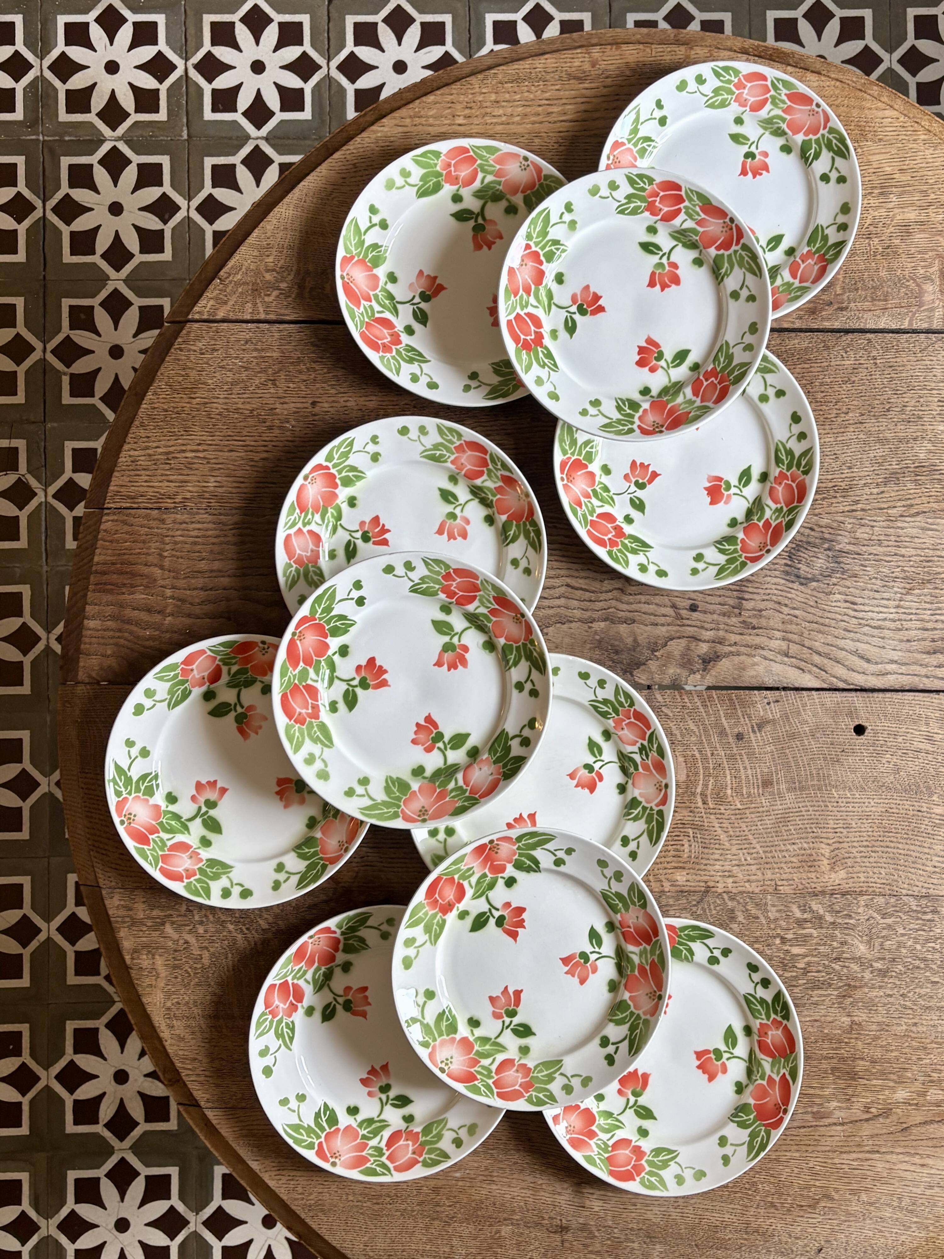 Set of 11 vintage flat plates by Eric de Moulin des Loups.