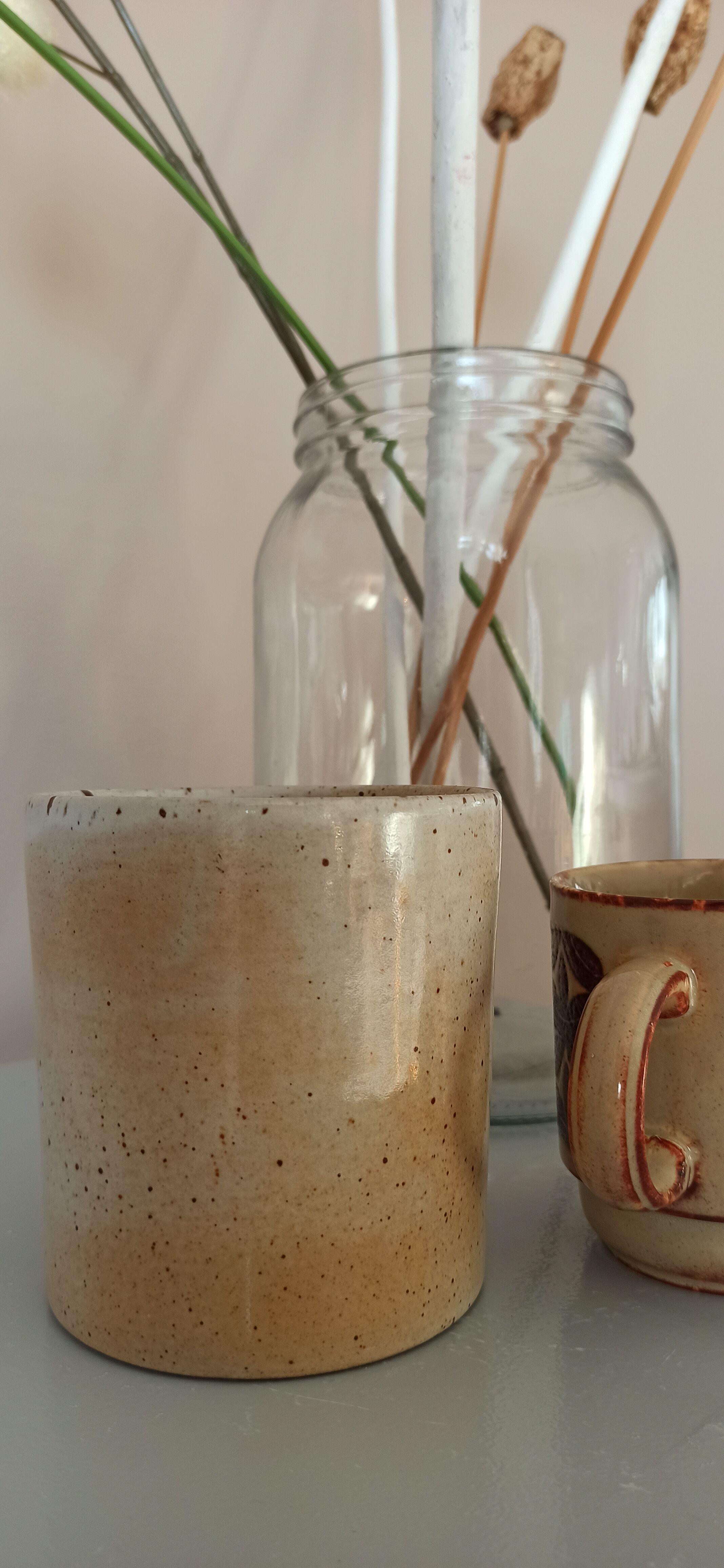 Coffee pot and mug cup in sandstone