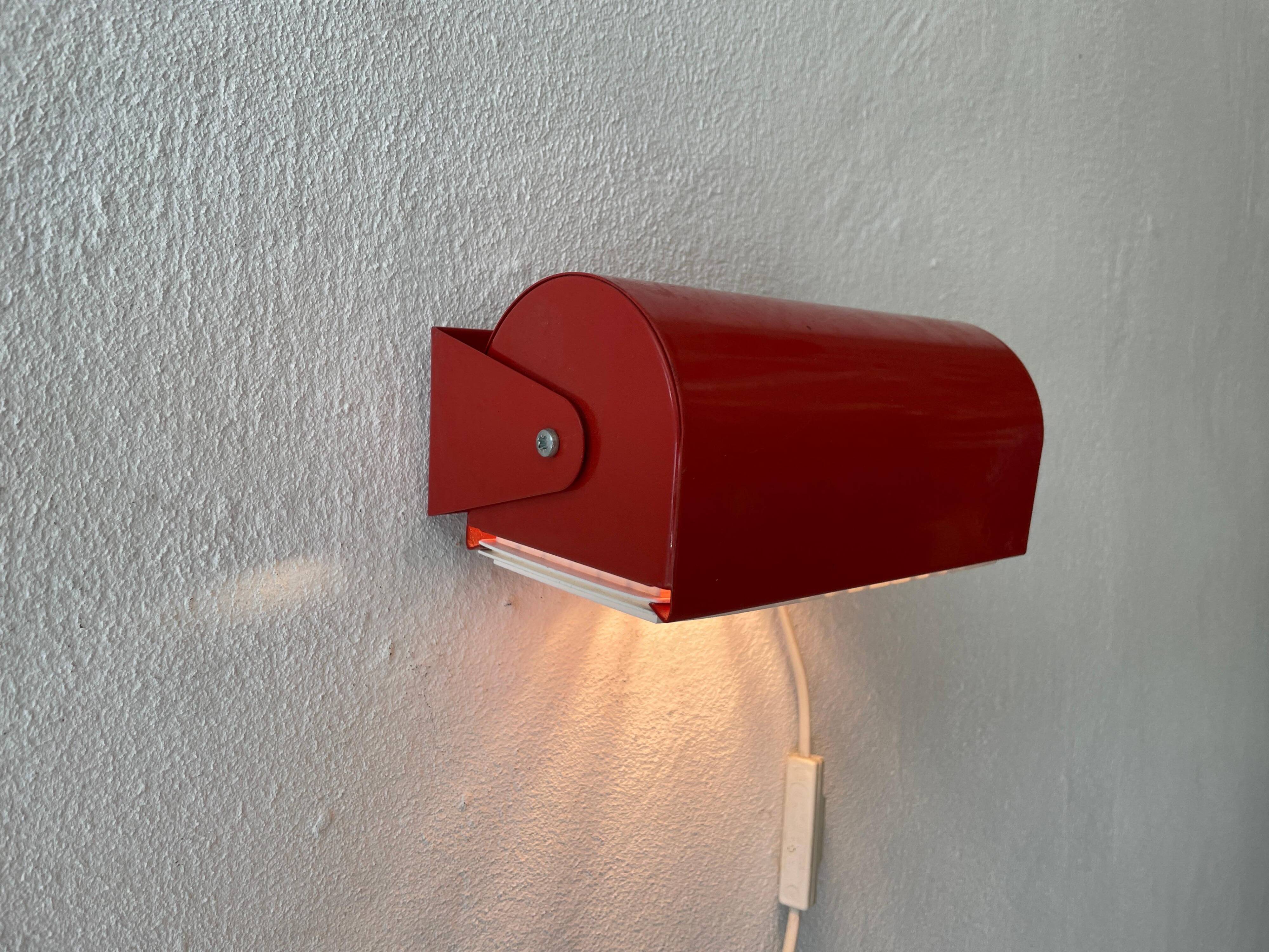 Simple red metal wall light from the AGE, 1970s, Germany.