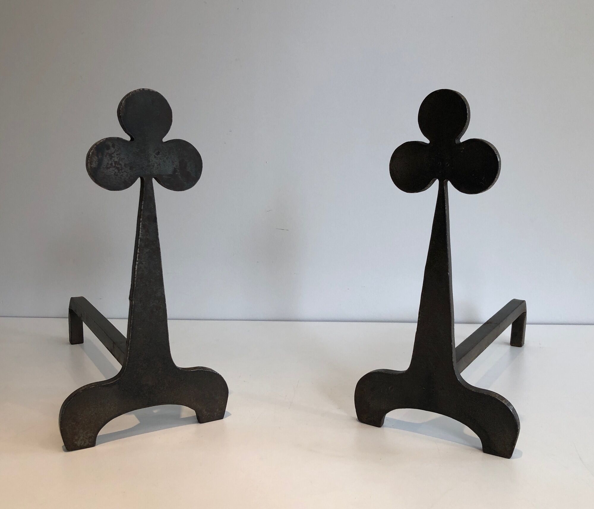 Pair of wrought steel and iron chenets with clover decorations 1950