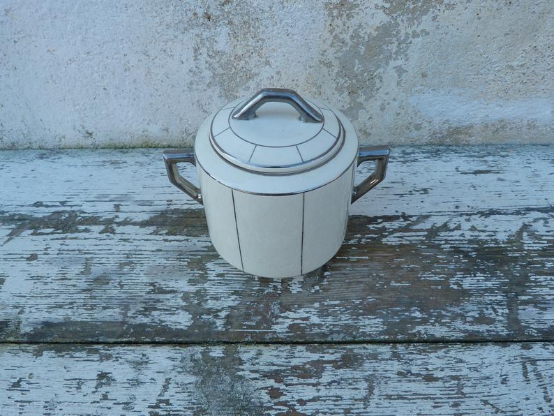 Off-white sugar and silver Art Deco Wolves Mill
