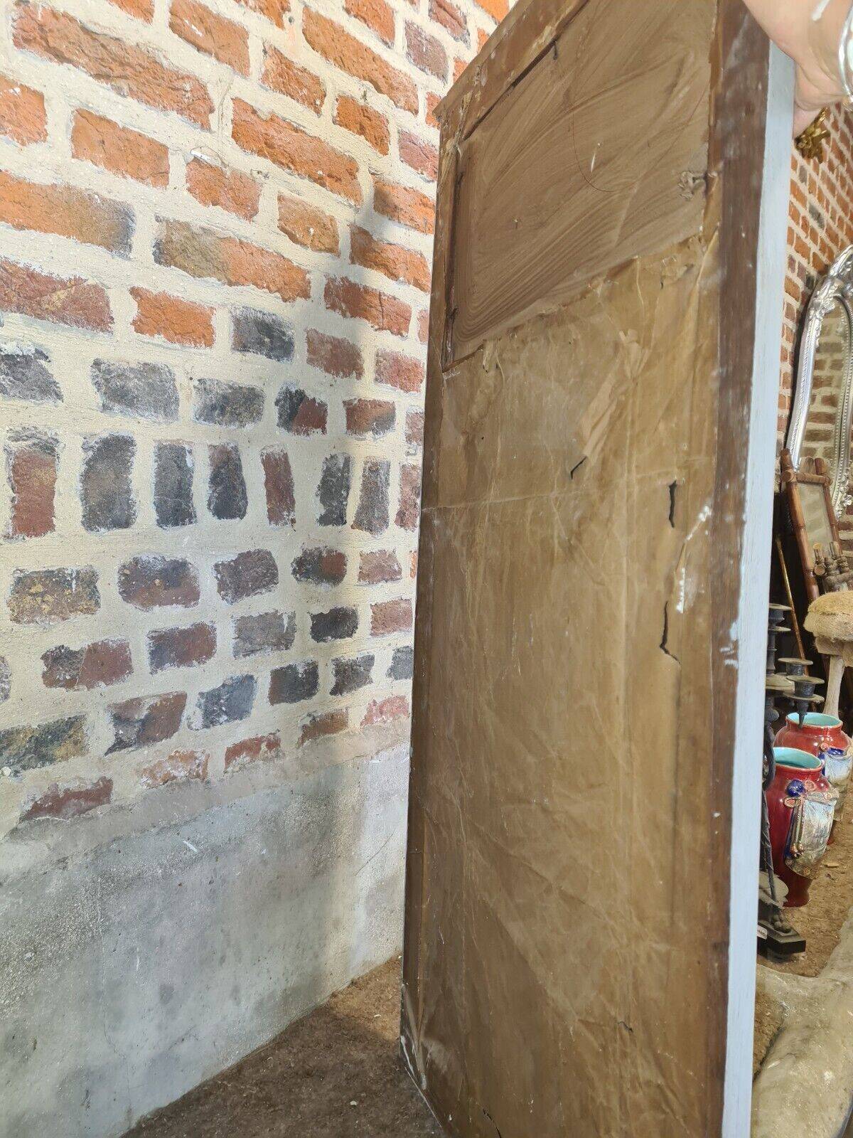 gray and gold patinated trumeau mirror