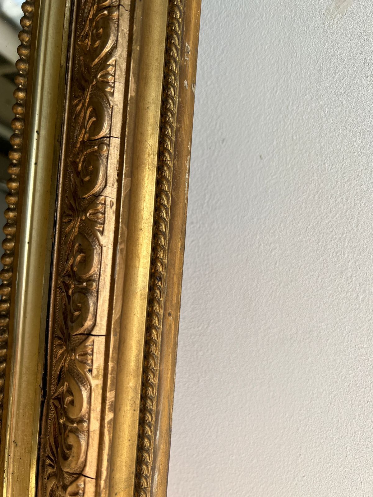 Gilded mirror with frieze h2m10 l:73cm