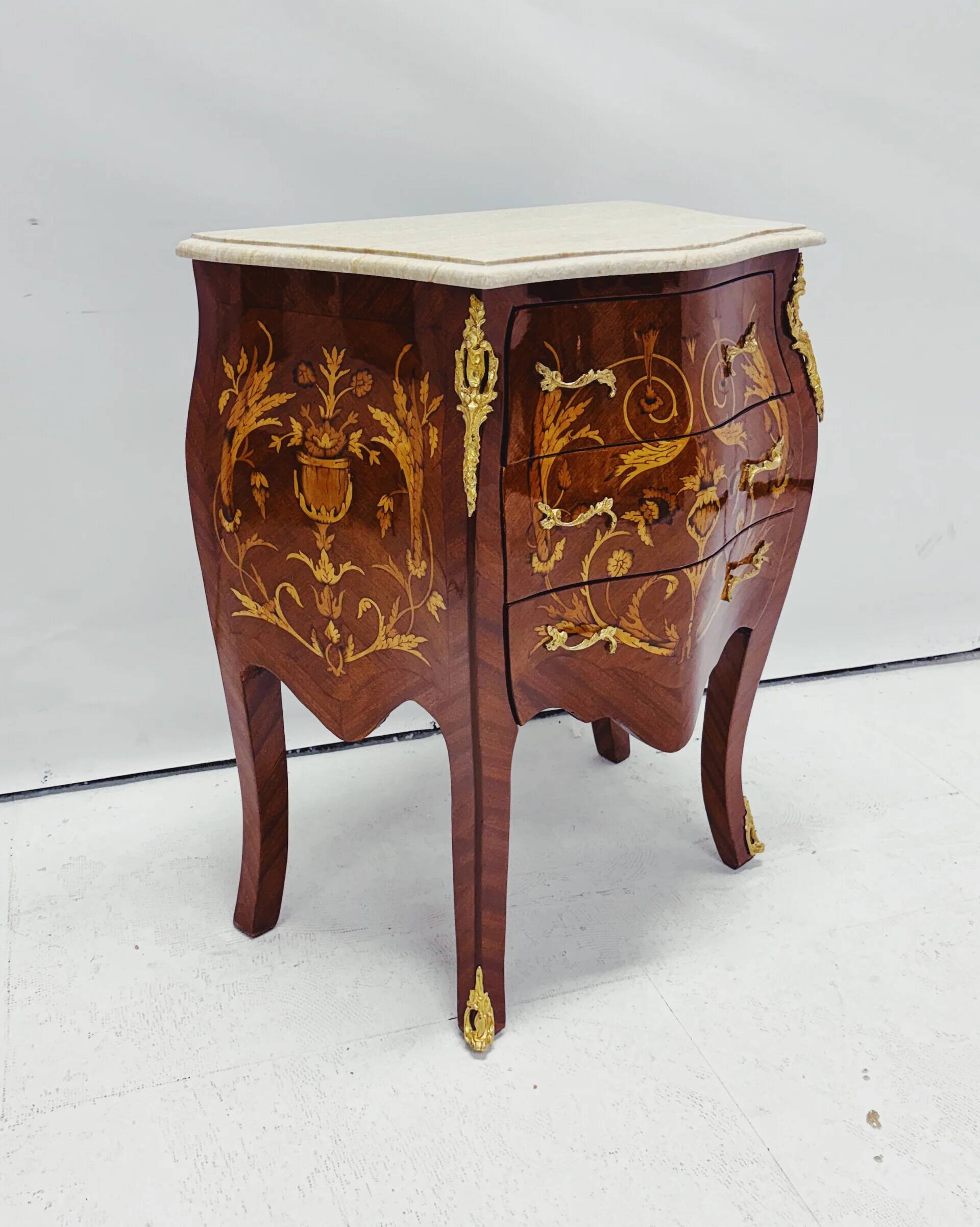 Marquetry chest of drawers with marble top in Louis XV style