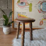 Old farm stool, wooden tripod campaign