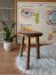 Old farm stool, wooden tripod campaign