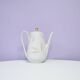 White teapot with pastel flowers