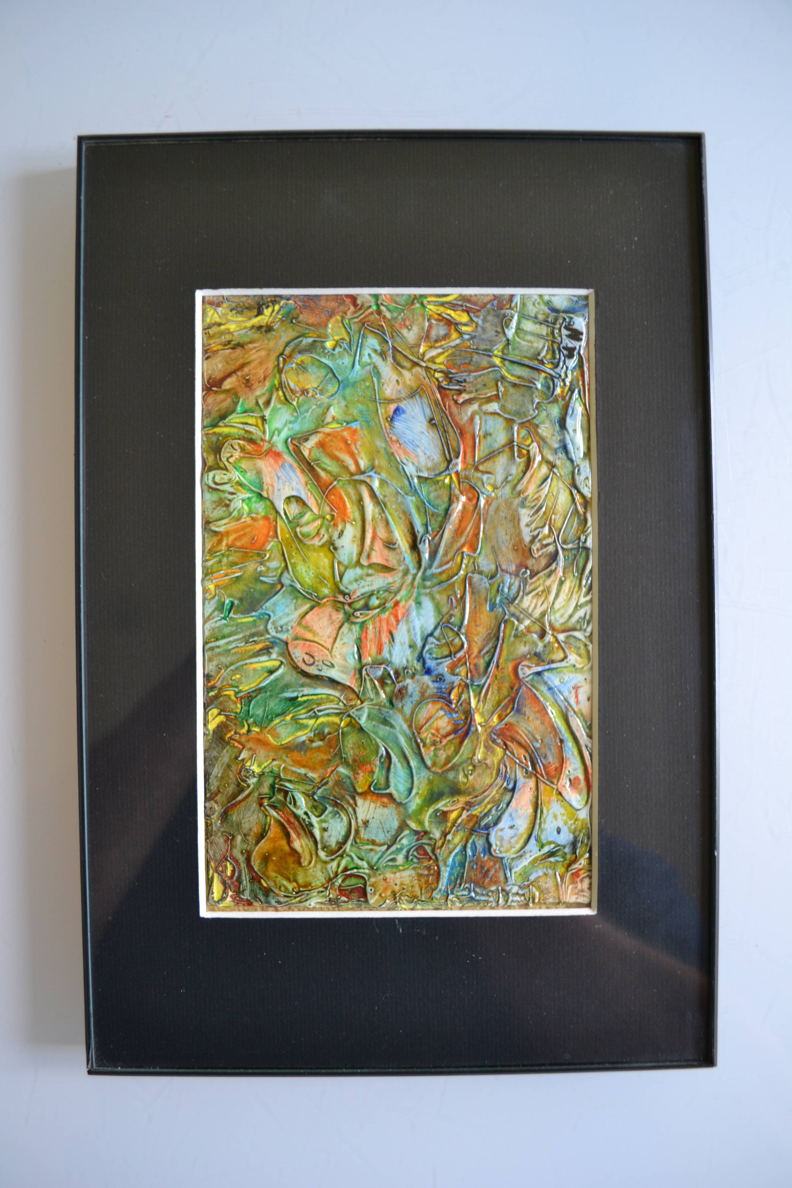 Framed abstract painting under glass