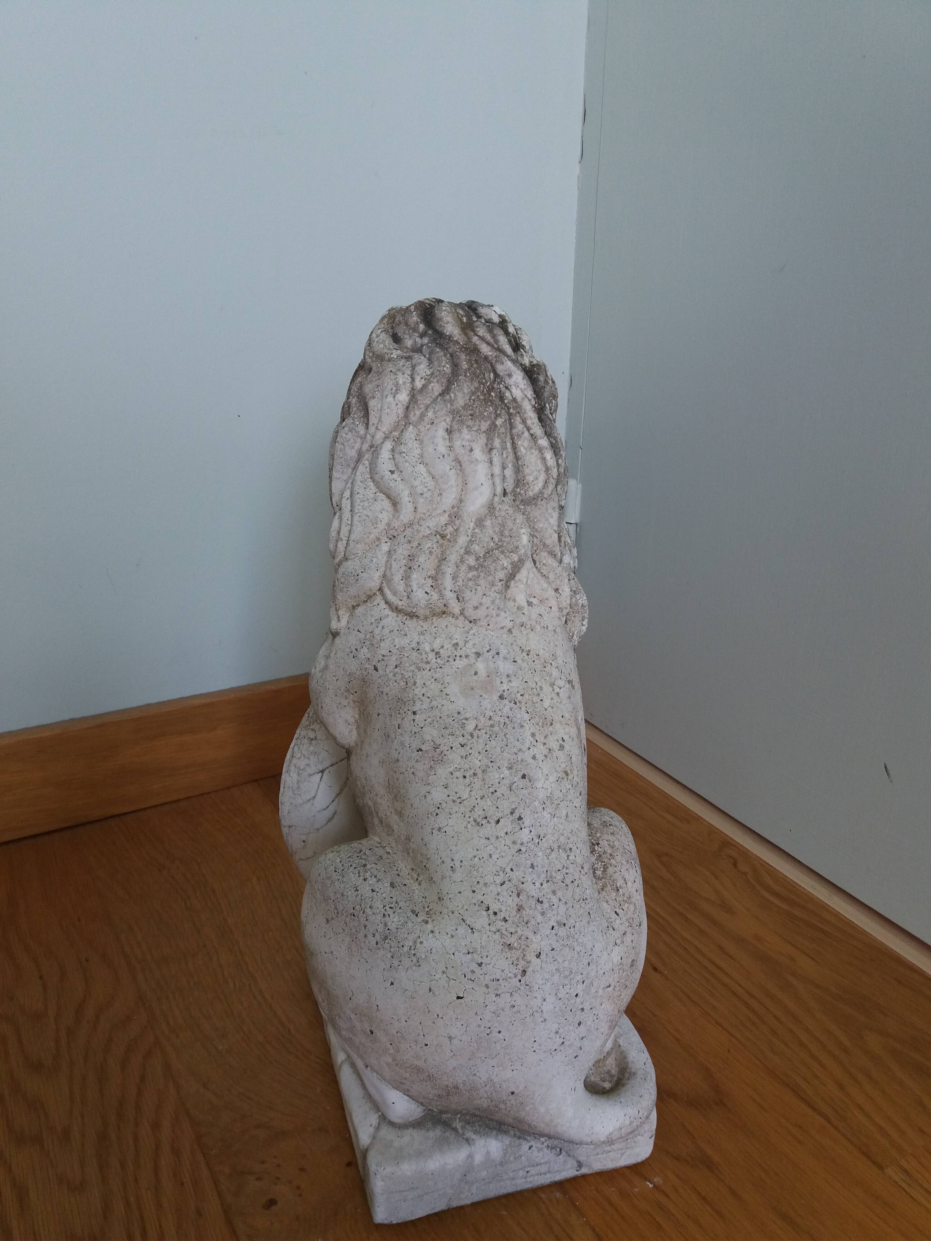Lion garden statue in reconstituted stone