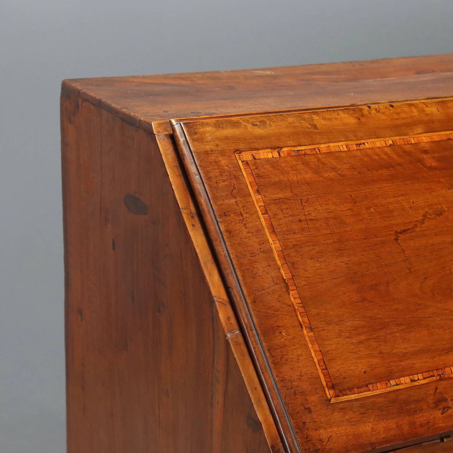 Antique drop-leaf cabinet in walnut with maple inlays, Italy, mid-18th century.
