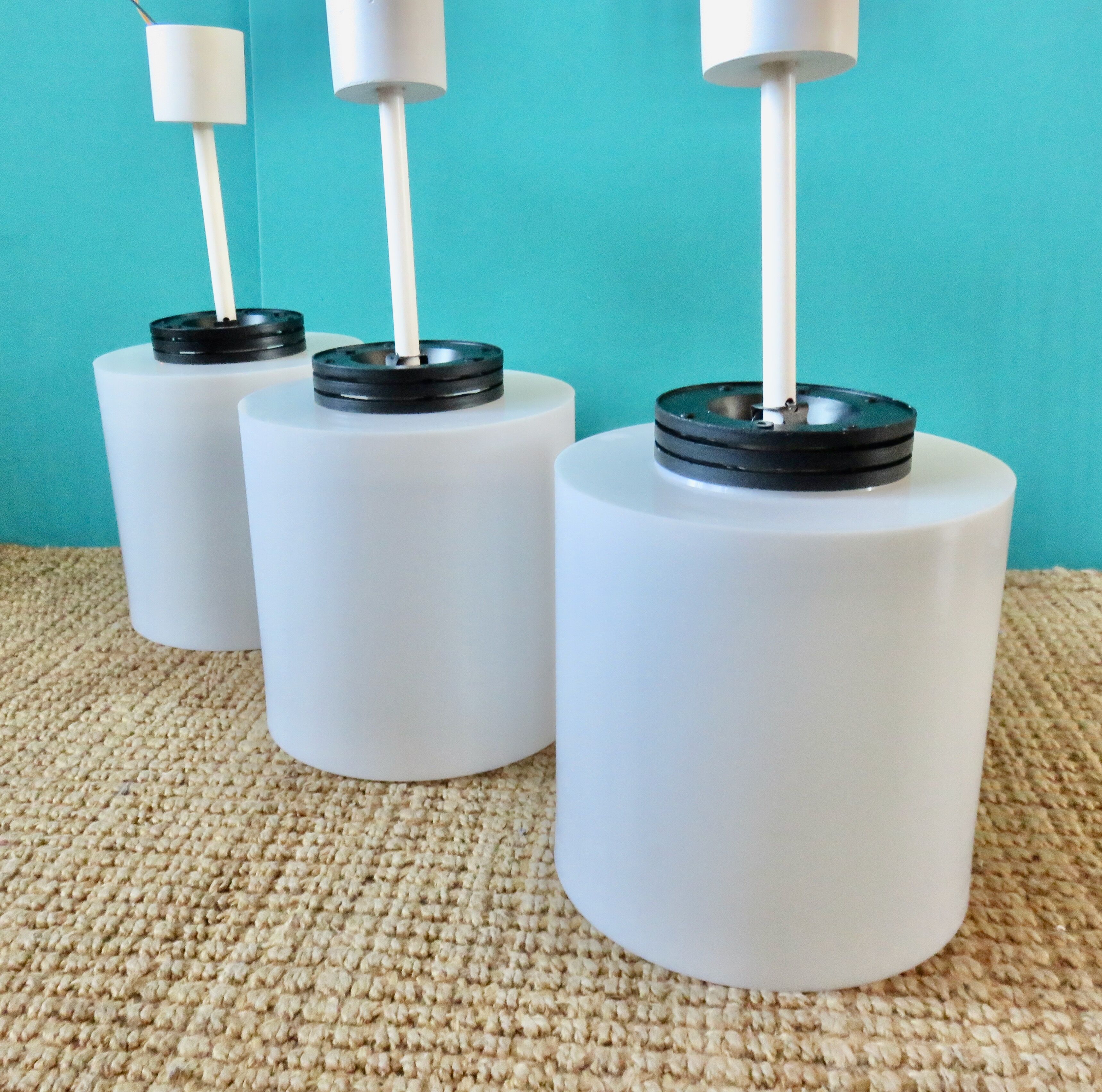 Three cylindrical suspensions in white resin, France 1970.