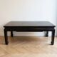 Chinese coffee table in black and gold wood.