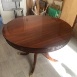 Round mahogany dining table