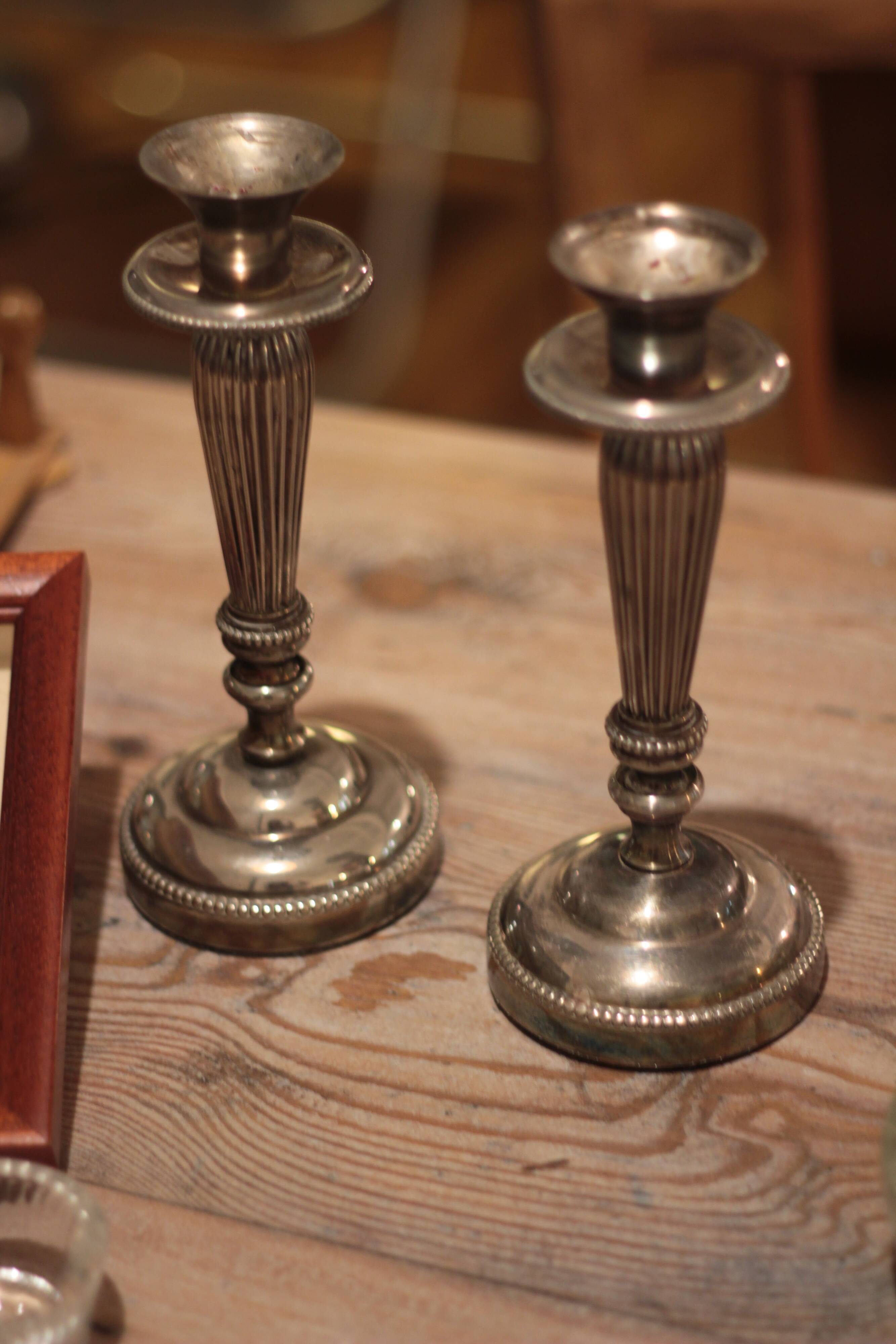 Pair of silver metal candlesticks